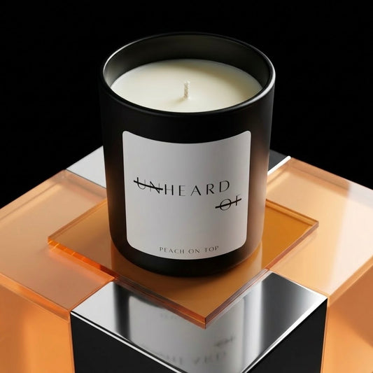 UNHEARD OF Peach On Top luxury candle, matte black jar with 8oz hand-poured wax, edgy minimalist home decor, high-end peach scented candle.